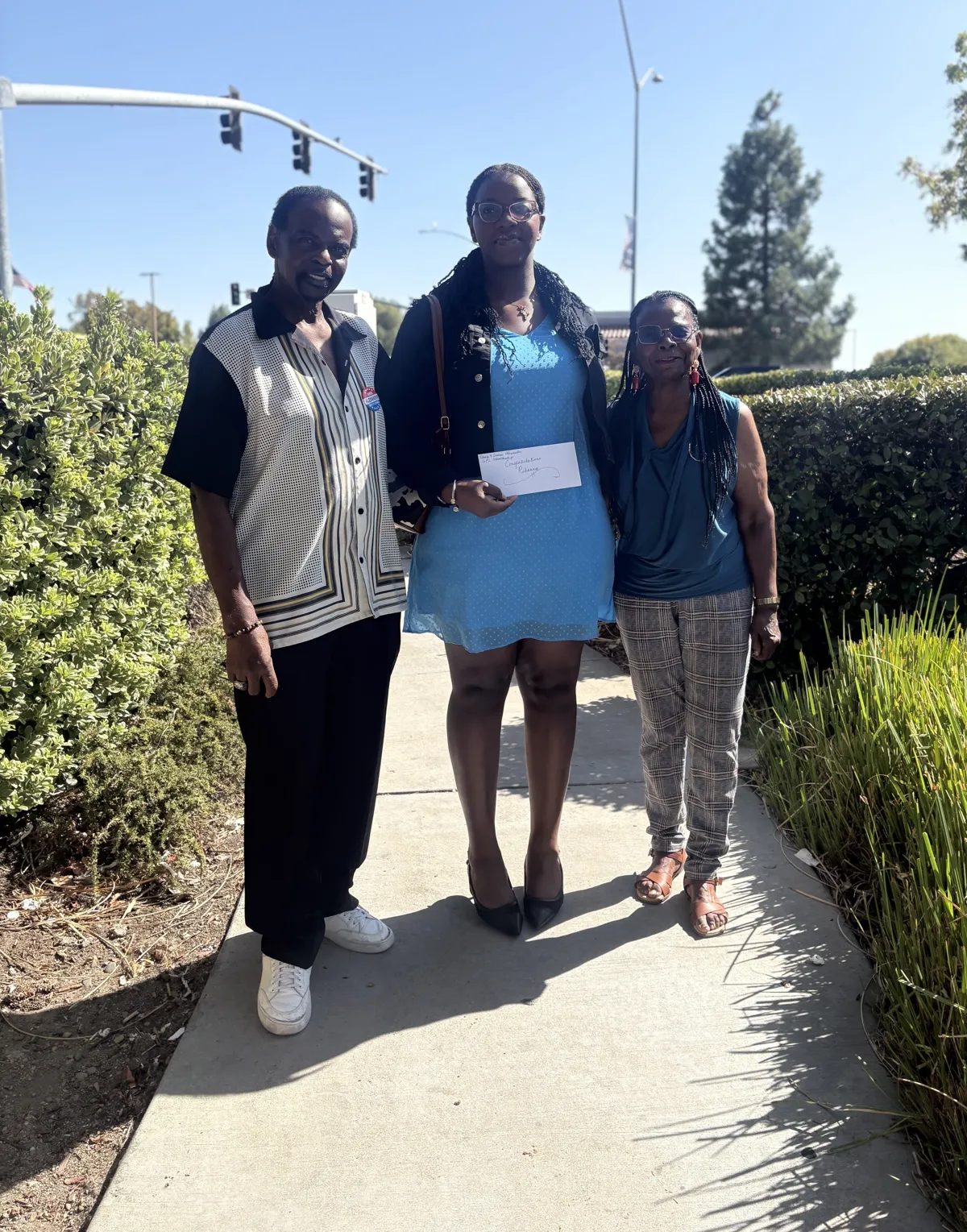 Ameni awarding a GFL Scholarship to a recipient